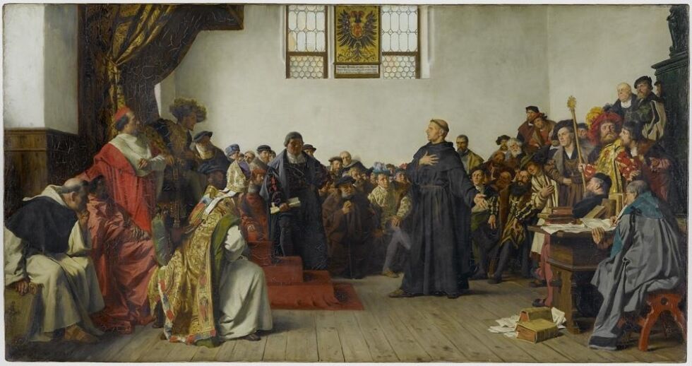 Peformasjonen: Martin Luther ved riksdagen i Worms, hvor han nektet å tilbakekalle sine verker og som deretter ble dømt kjetterske av den katolske kirke. Maleri av Anton von Werner, 1877, Staatsgalerie Stuttgart.